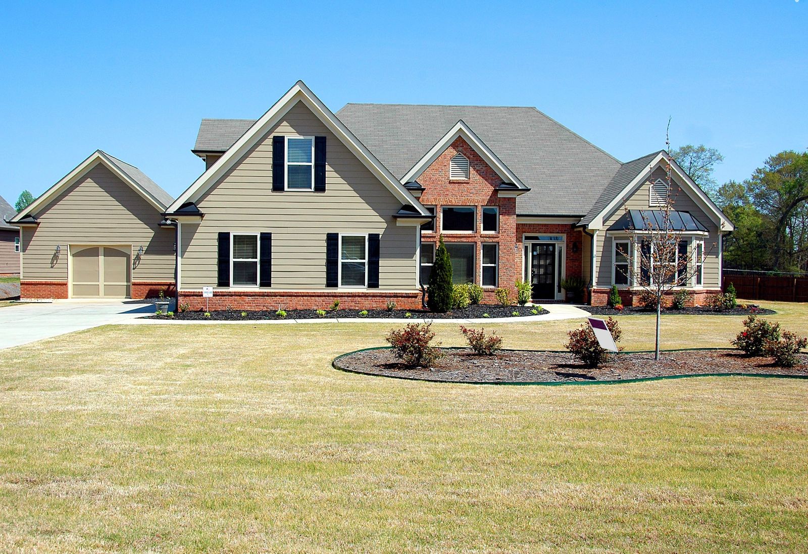 Newly installed roof on a large brick home in Central Texas